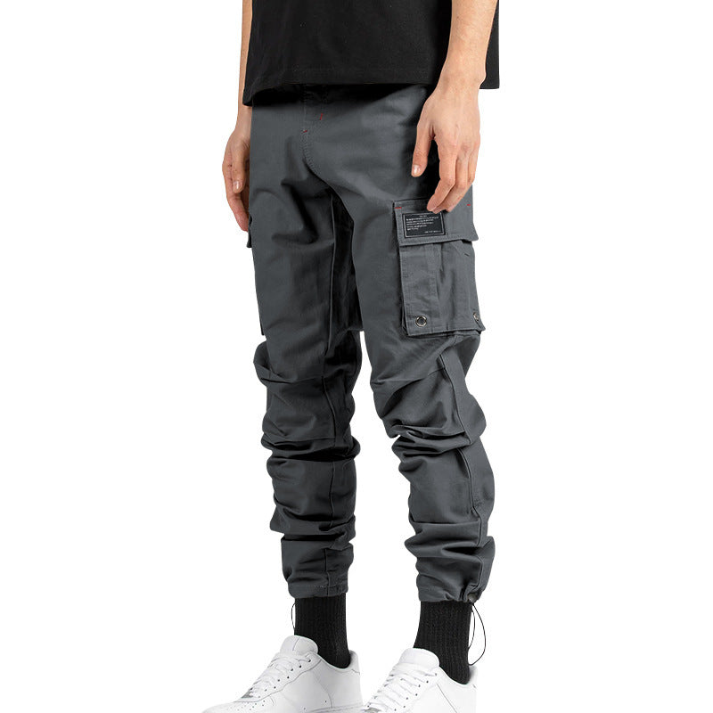 Pantalones cargo holgados de color liso para hombre de AriasCreative, con múltiples bolsillos y puños con cordón.