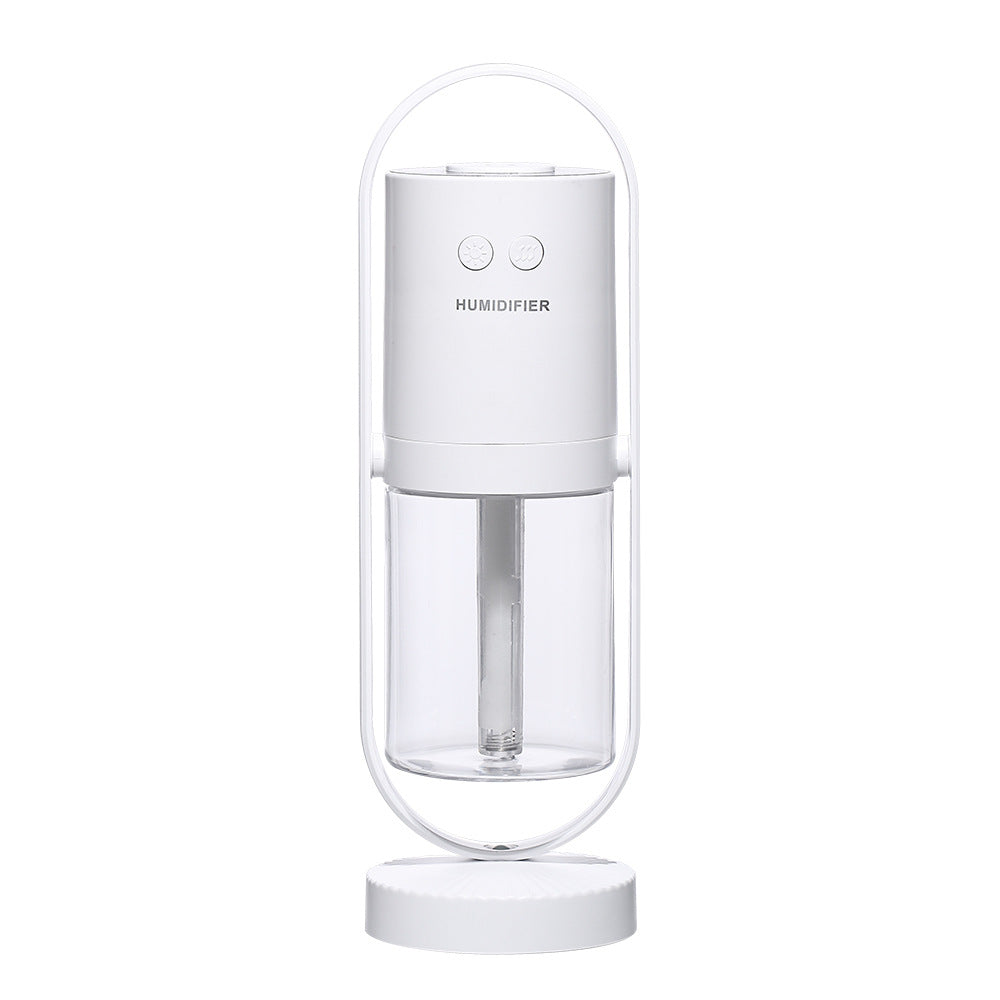 Humidificador ultrasónico USB AriasCreative con luz nocturna y proyector de sombras en un ambiente de dormitorio o oficina