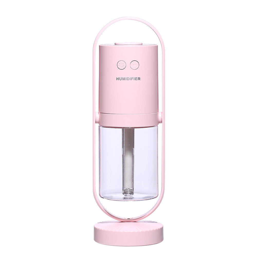 Humidificador ultrasónico USB AriasCreative con luz nocturna y proyector de sombras en un dormitorio, oficina o coche.