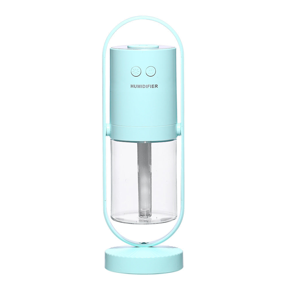 Humidificador ultrasónico USB AriasCreative con luz nocturna y proyector de sombras en un ambiente de dormitorio o oficina