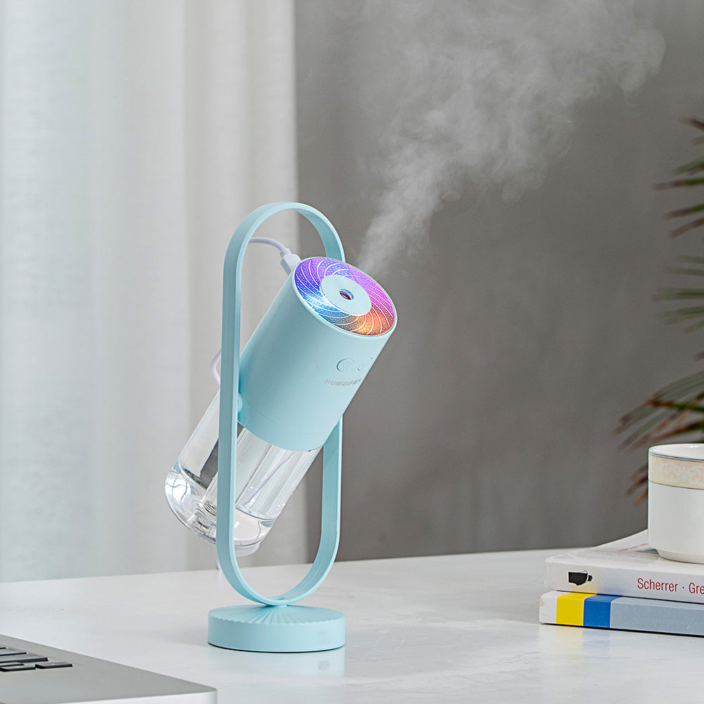 Humidificador ultrasónico USB AriasCreative con luz nocturna y proyector de sombras en color blanco, ideal para dormitorio y oficina.