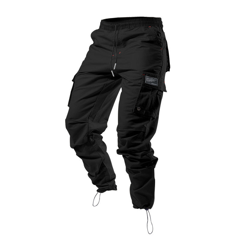 Pantalones cargo holgados de hombre en color liso con múltiples bolsillos y puños con cordón, marca AriasCreative.